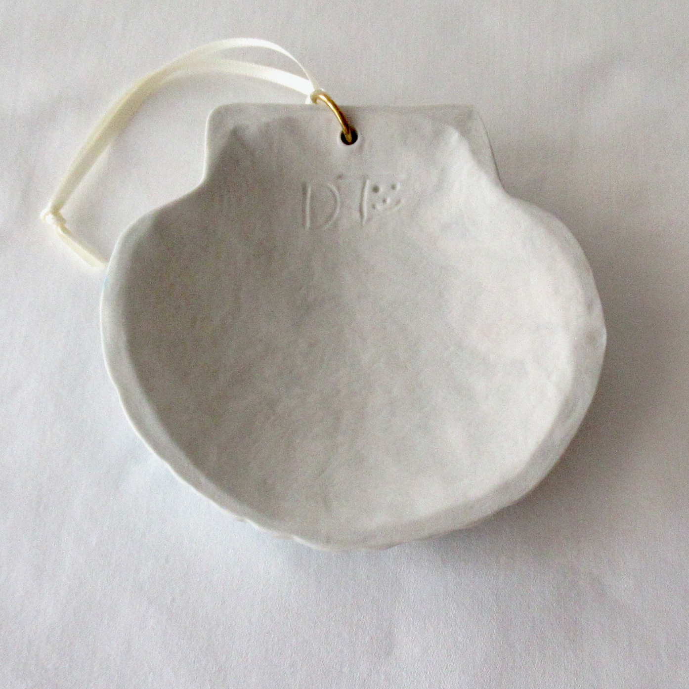 Handmade Seashell Blue and White Colored Porcelain Hanging Ornament. Ceramic Pottery.