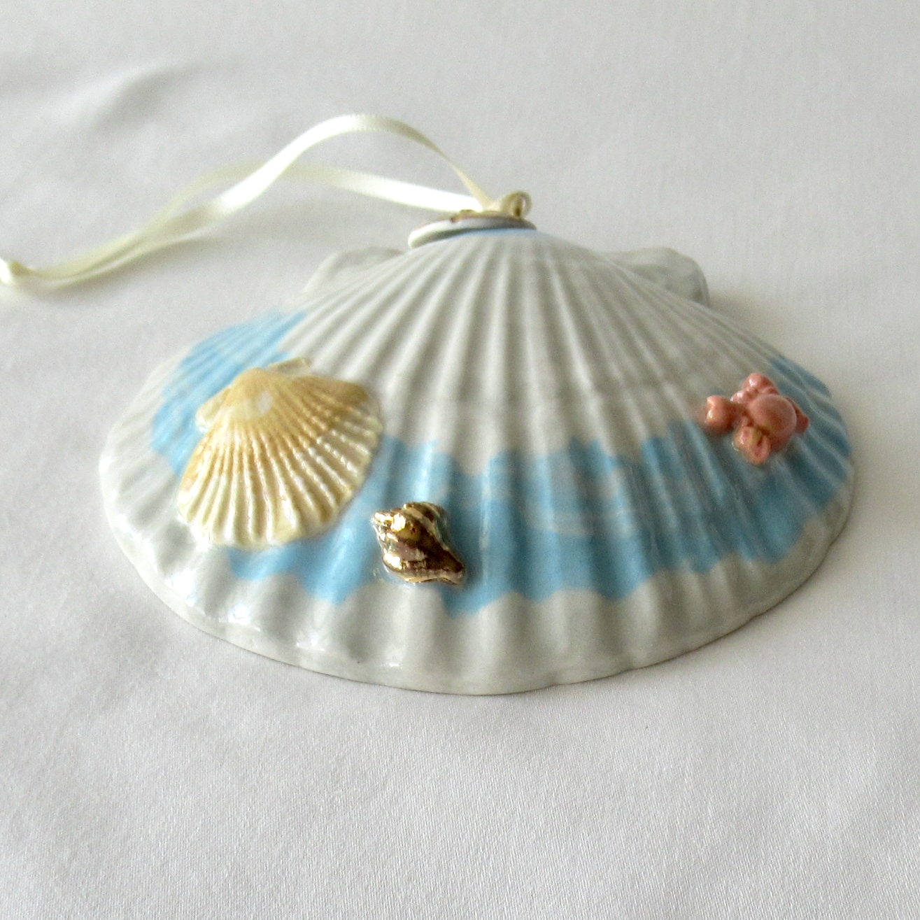 Handmade Seashell Blue and White Colored Porcelain Hanging Ornament. Ceramic Pottery.