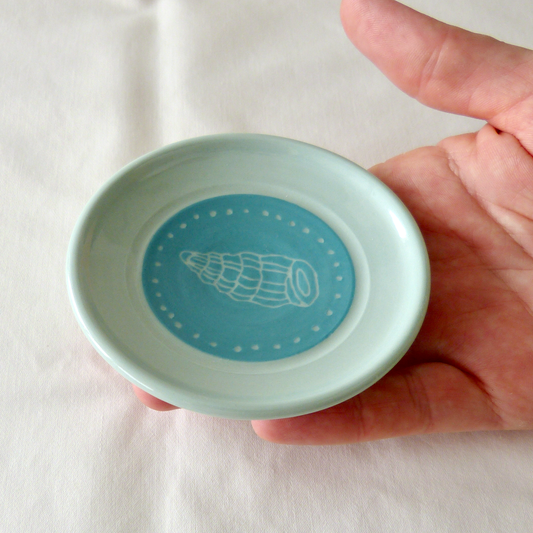 A Blue Porcelain Wheel- thrown, Conch Shell Sgraffito Shallow Bowl.