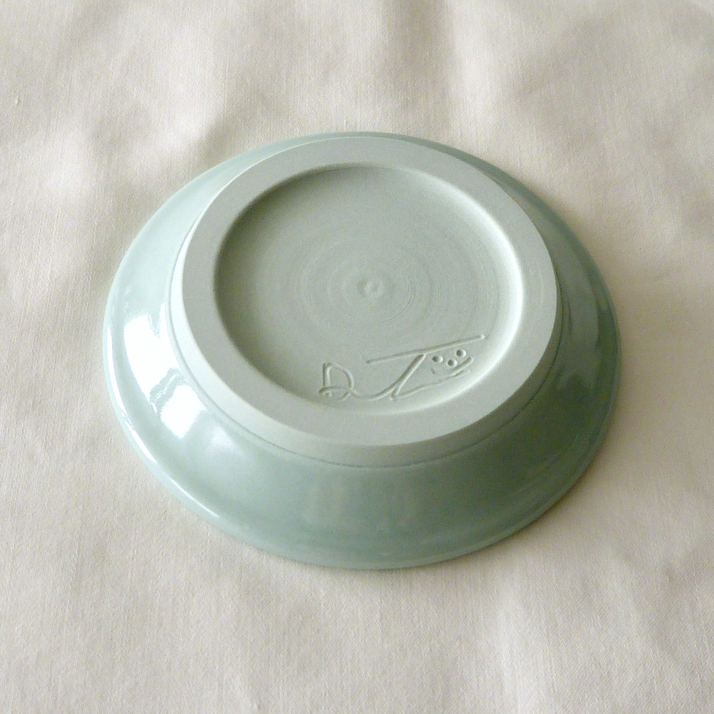A Blue Porcelain Wheel- thrown, Conch Shell Sgraffito Shallow Bowl.