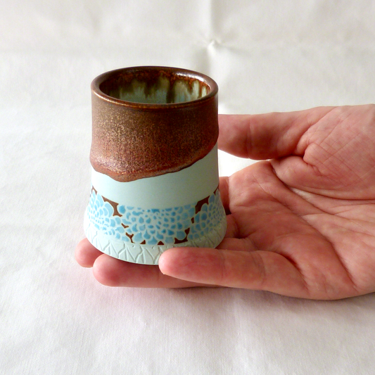 A Blue Turquoise Dahlia Bud Vase with Copper Float Rim