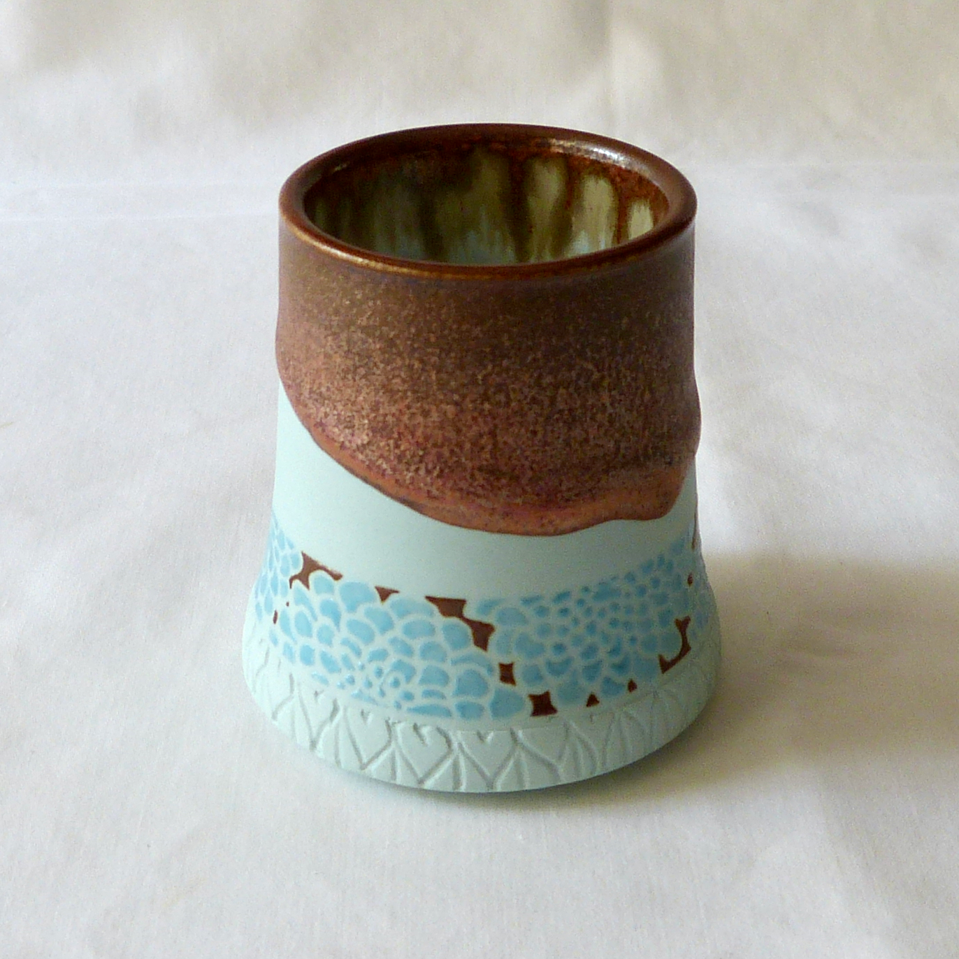 A Blue Turquoise Dahlia Bud Vase with Copper Float Rim