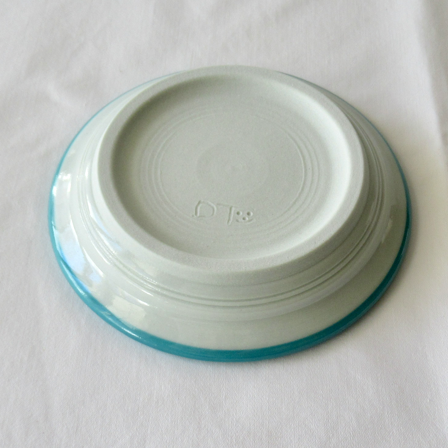 A Small Wheel-thrown Sgraffito Conch Shell Plate