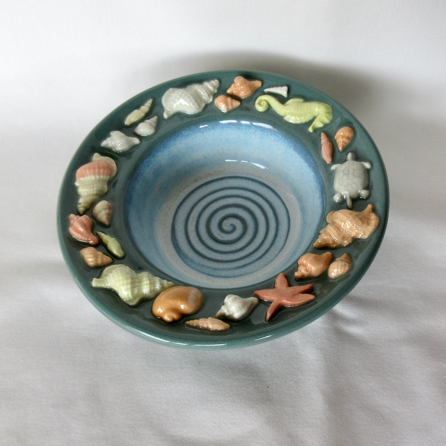 Handmade Dark Teal Colored Porcelain Seashell Trinket Bowl. Ceramic Pottery.