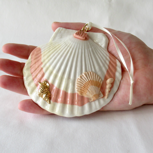 A Handmade Agateware Seashell, Peach Colored Porcelain Hanging Ornament. Ceramic Pottery.