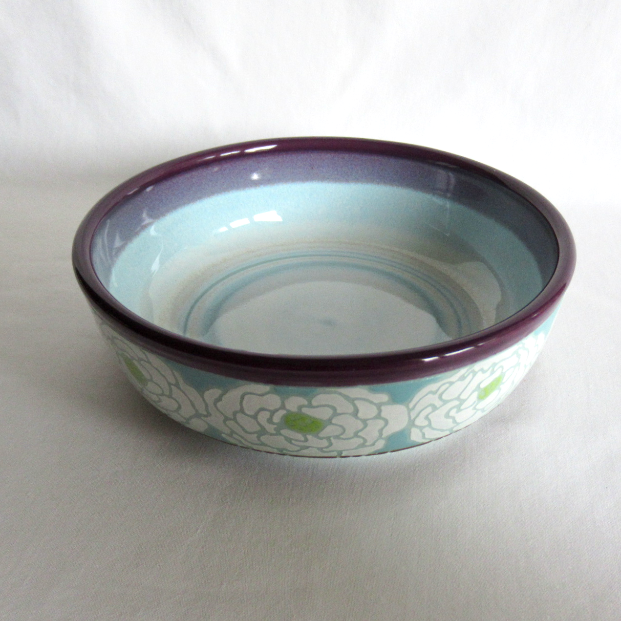 Handcrafted Shallow Bowl. Turquoise Blue Porcelain with Hand Drawn White Peonies