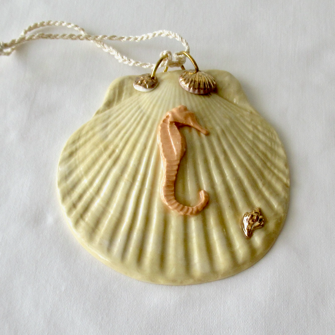 Handmade Seashell Pale Yellow Colored Porcelain Hanging Ornament. Ceramic Pottery.