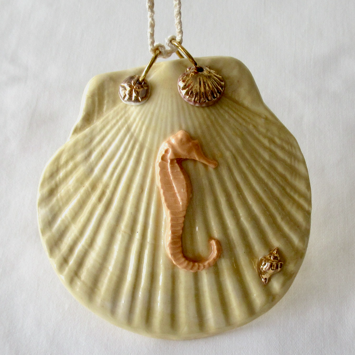 Handmade Seashell Pale Yellow Colored Porcelain Hanging Ornament. Ceramic Pottery.