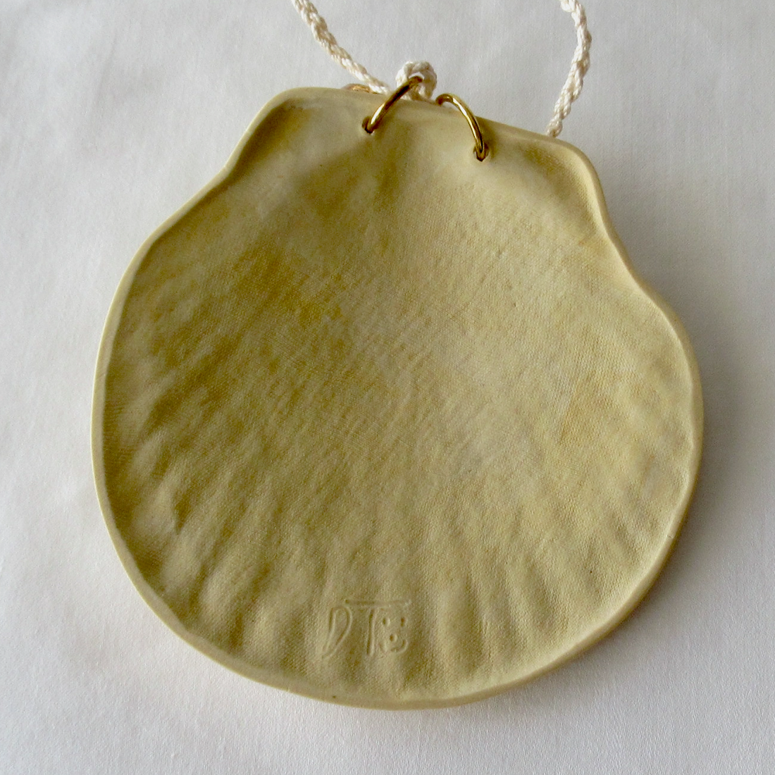 Handmade Seashell Pale Yellow Colored Porcelain Hanging Ornament. Ceramic Pottery.