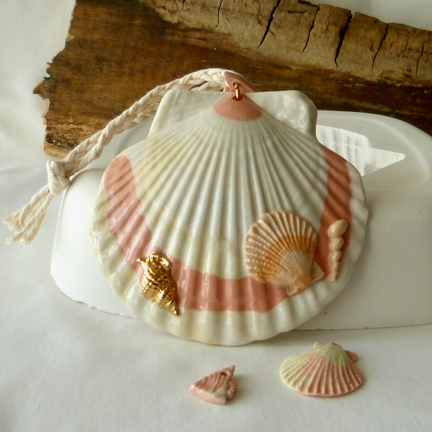 A Handmade Agateware Seashell, Peach Colored Porcelain Hanging Ornament. Ceramic Pottery.