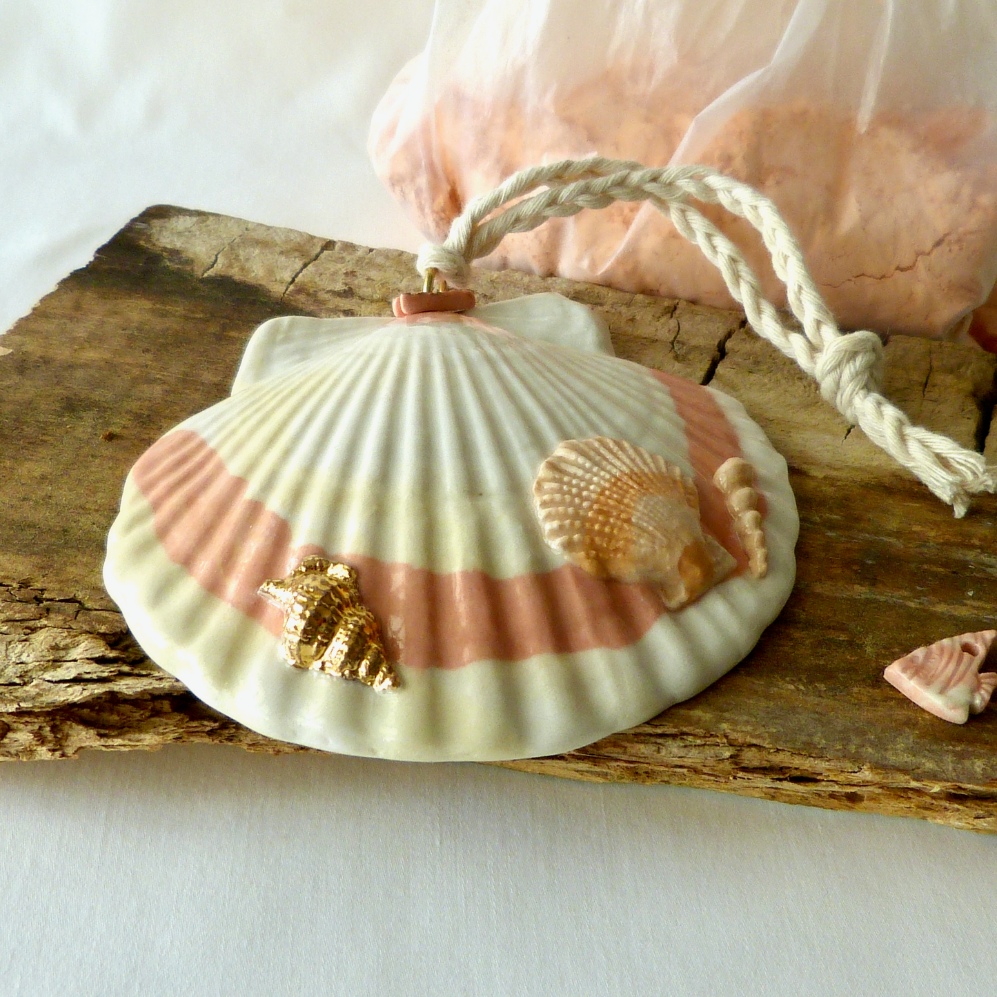 A Handmade Agateware Seashell, Peach Colored Porcelain Hanging Ornament. Ceramic Pottery.
