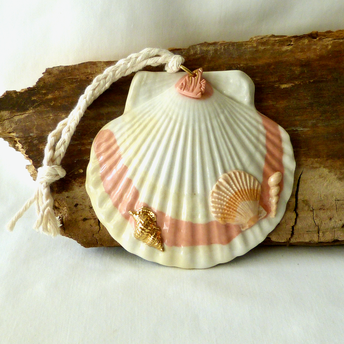 A Handmade Agateware Seashell, Peach Colored Porcelain Hanging Ornament. Ceramic Pottery.