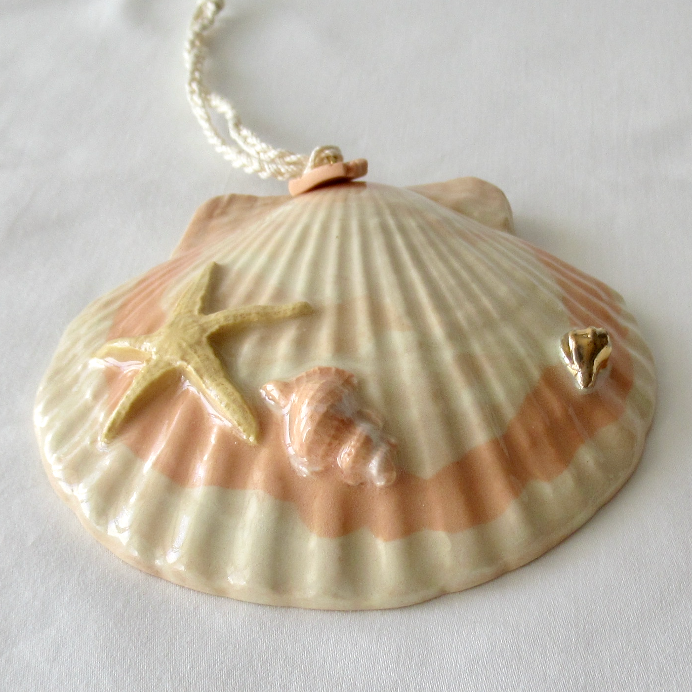 Handmade Seashell Apricot Colored Porcelain Hanging Ornament. Ceramic Pottery.