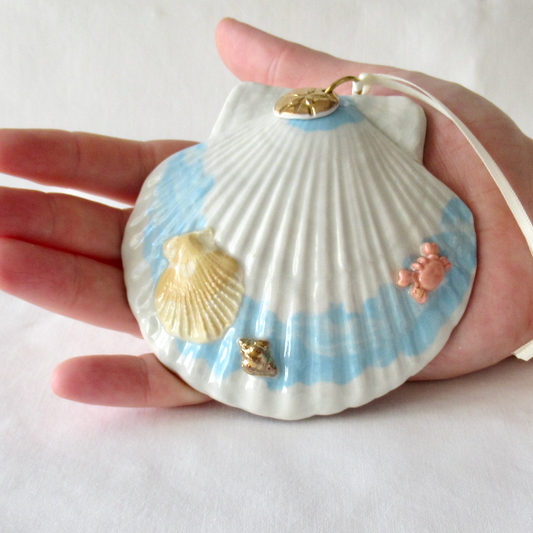 Handmade Seashell Blue and White Colored Porcelain Hanging Ornament. Ceramic Pottery.