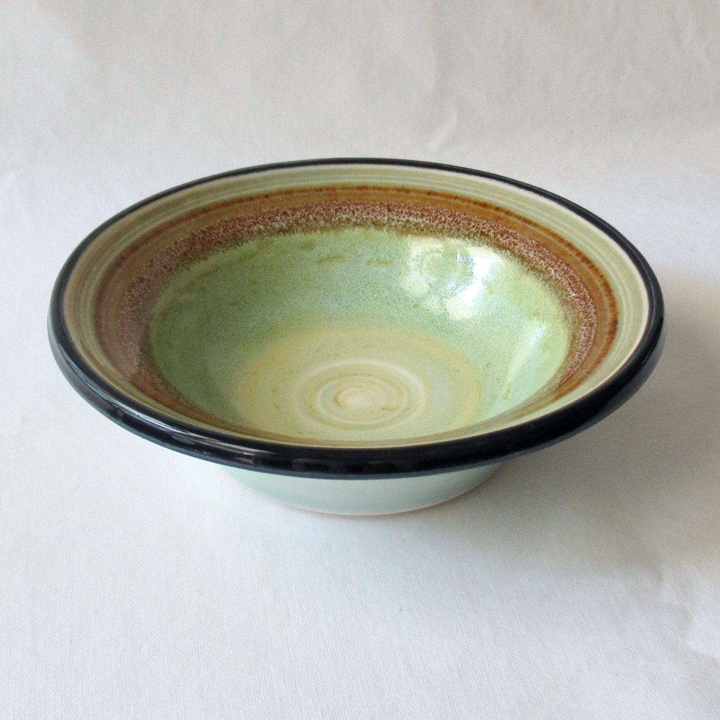 A Celadon Glazed Flared Rimmed Bowl