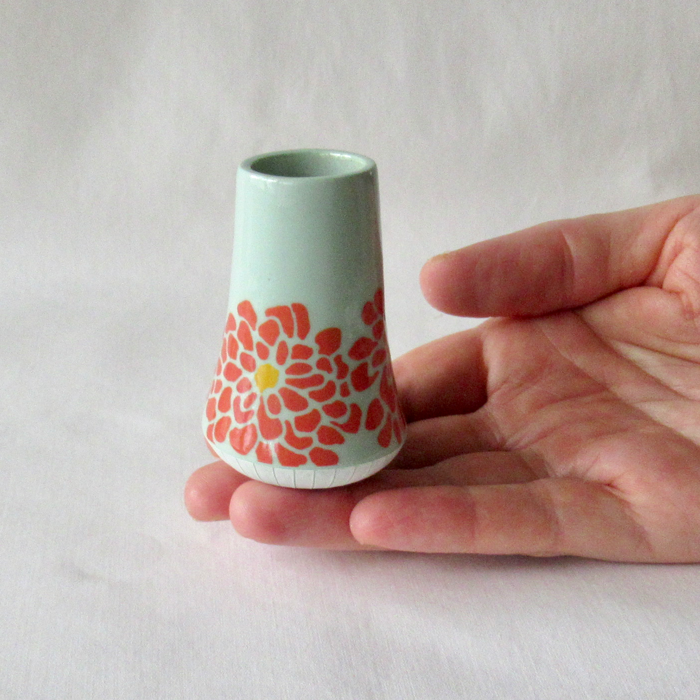 A Very Small Wheel-thrown Porcelain Bud Vase with Hand Glazed Zinnia Design