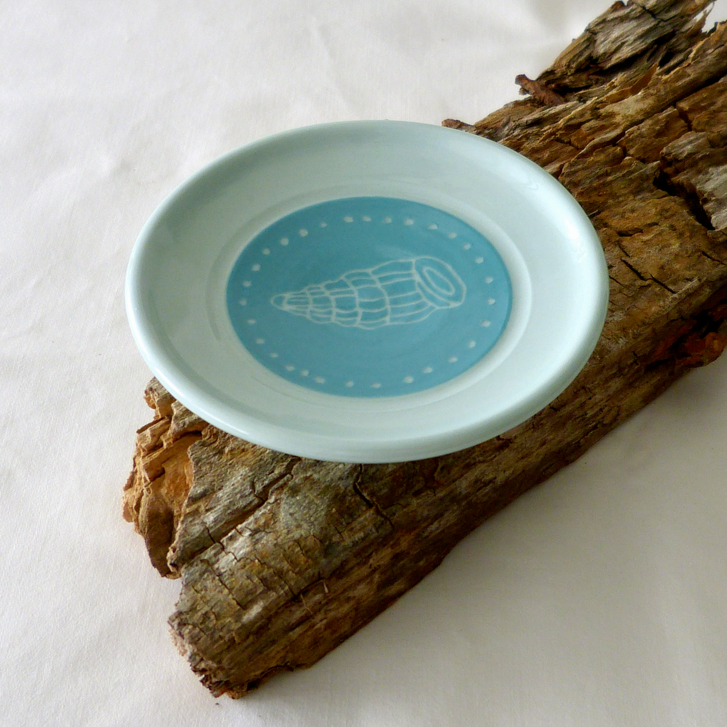 A Blue Porcelain Wheel- thrown, Conch Shell Sgraffito Shallow Bowl.