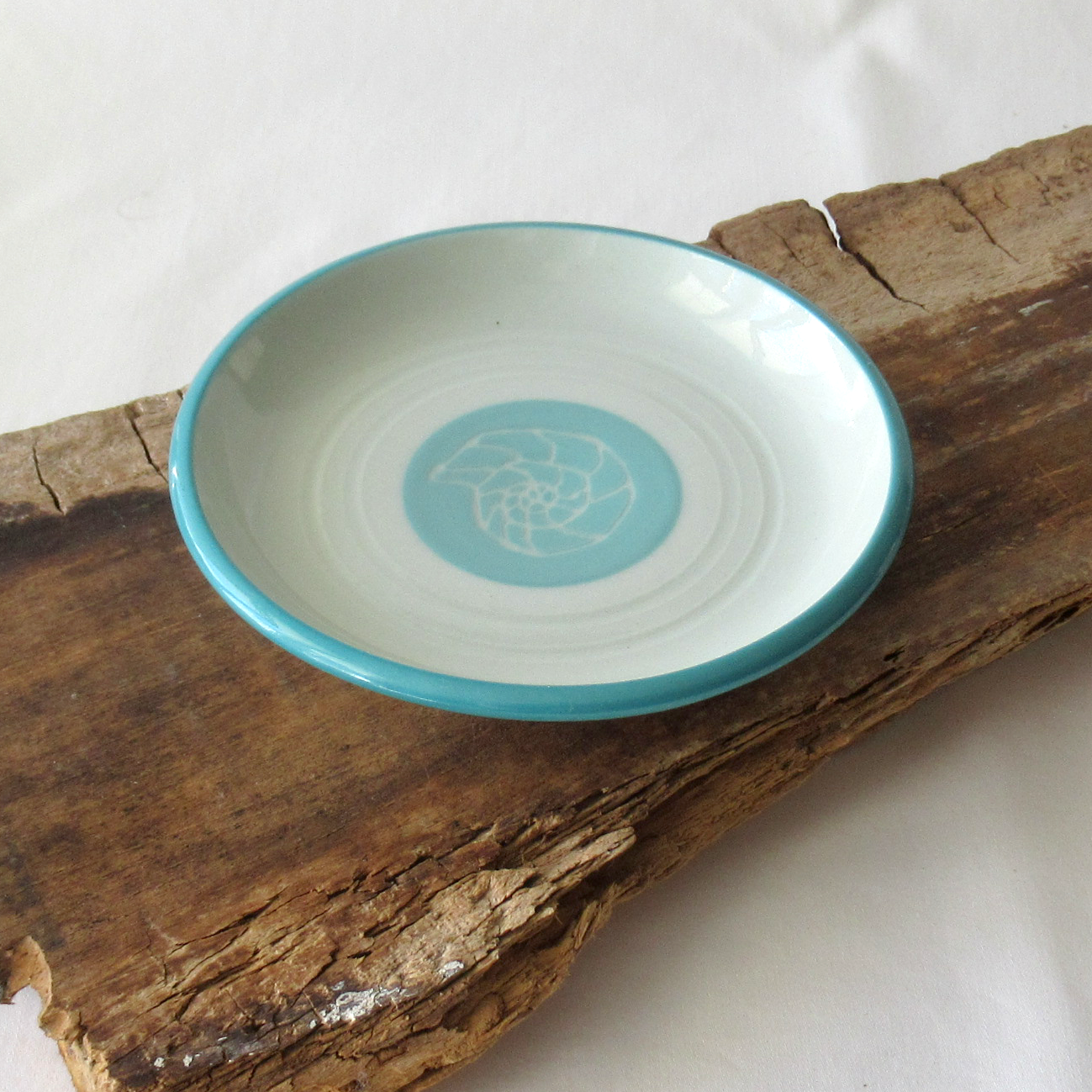 A Small Wheel-thrown Sgraffito Conch Shell Plate