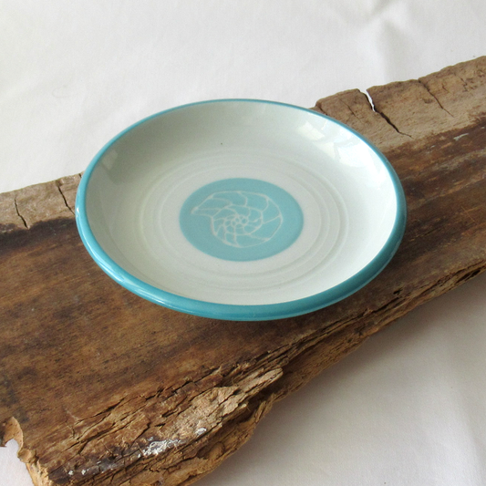 A Small Wheel-thrown Sgraffito Conch Shell Plate