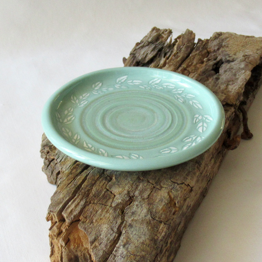 A Wheel-thrown Mint Green Porcelain "Leaf Clusters" Sgraffito Plate