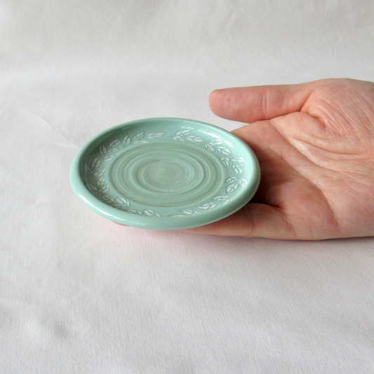 A Wheel-thrown Mint Green Porcelain "Leaf Clusters" Sgraffito Plate