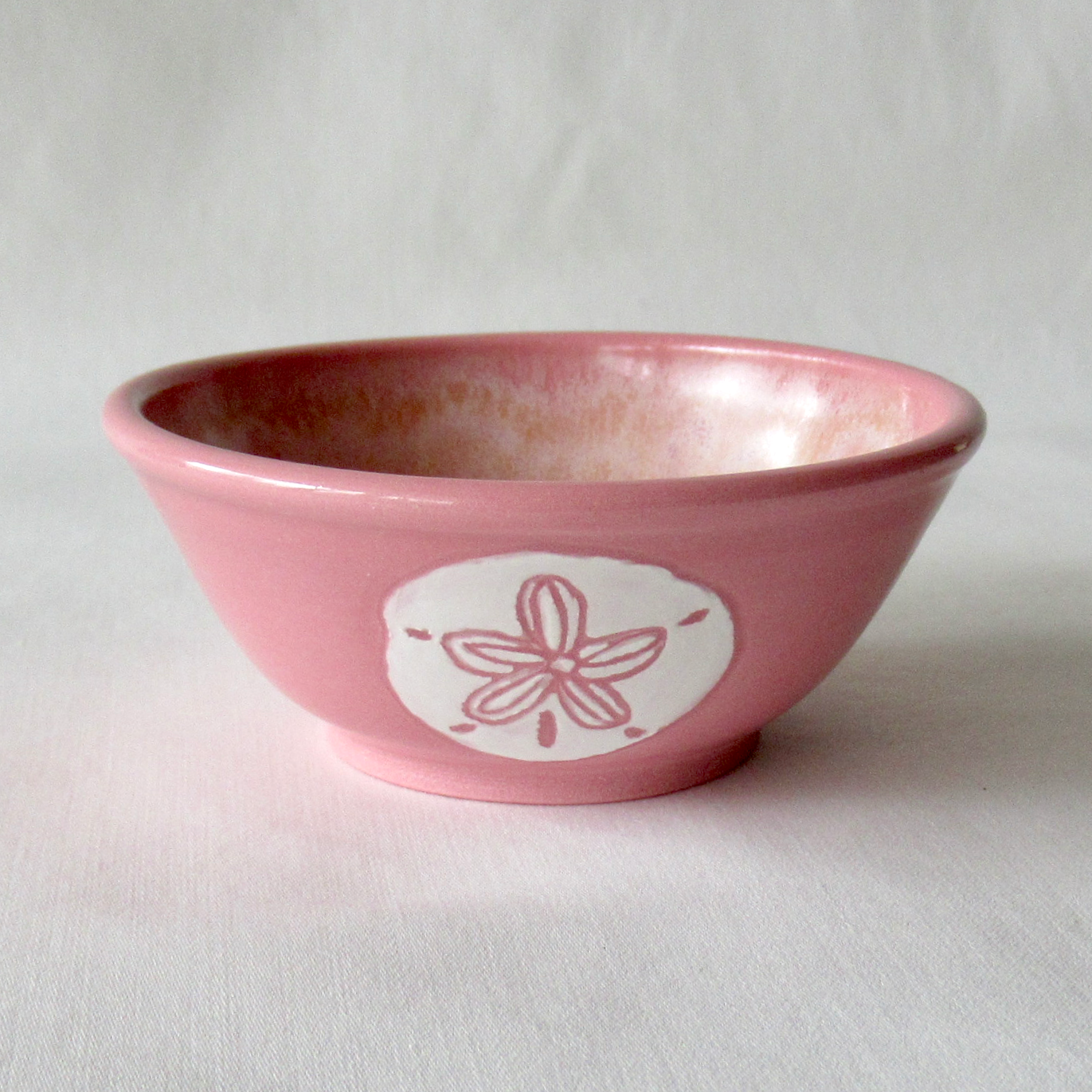 A Wheel-thrown Dark Pink Porcelain Sand Dollar Sgraffito Bowl