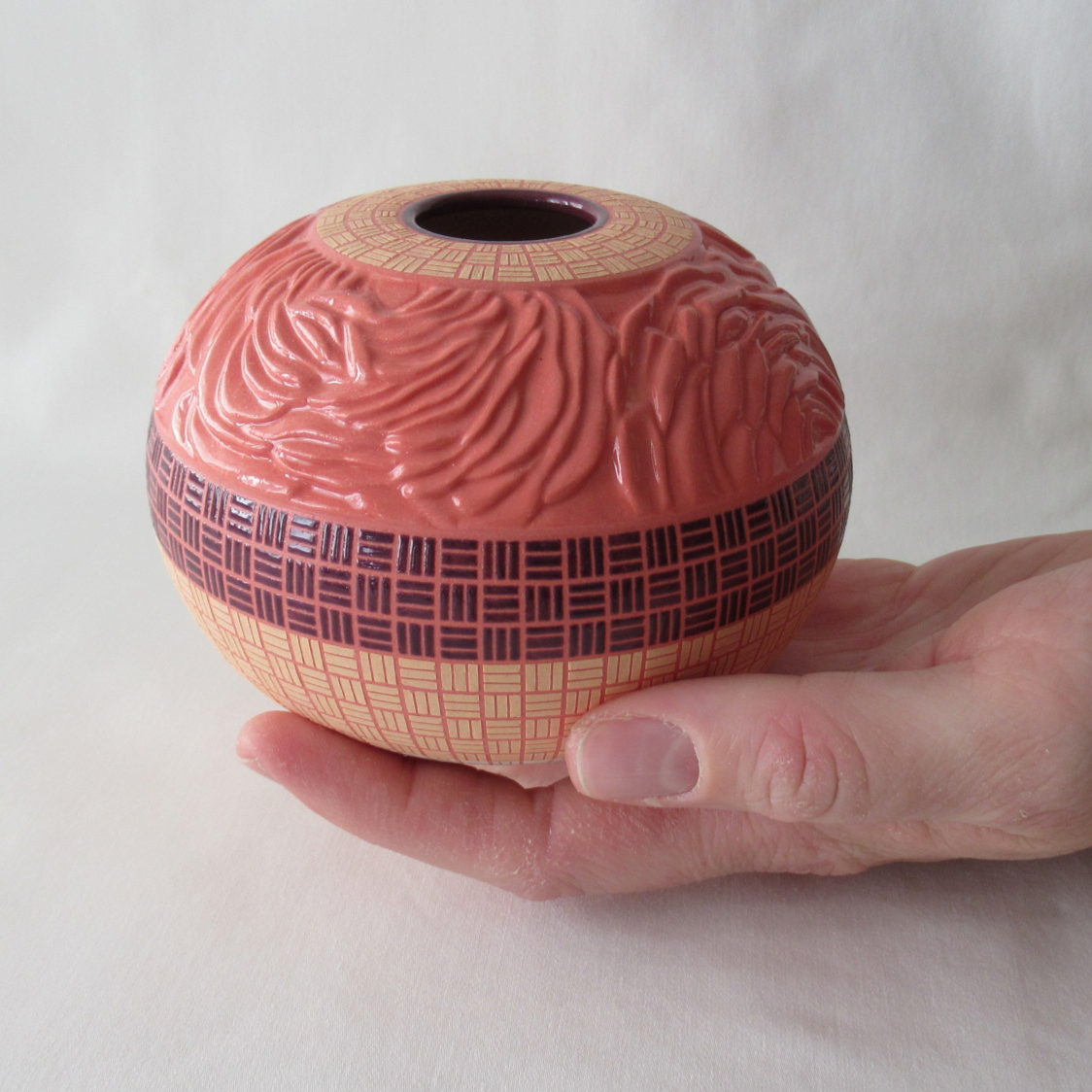 A Hand Carved Ranunculus Bowl with Checkered Design. Wheel-thrown Ceramic Pottery.