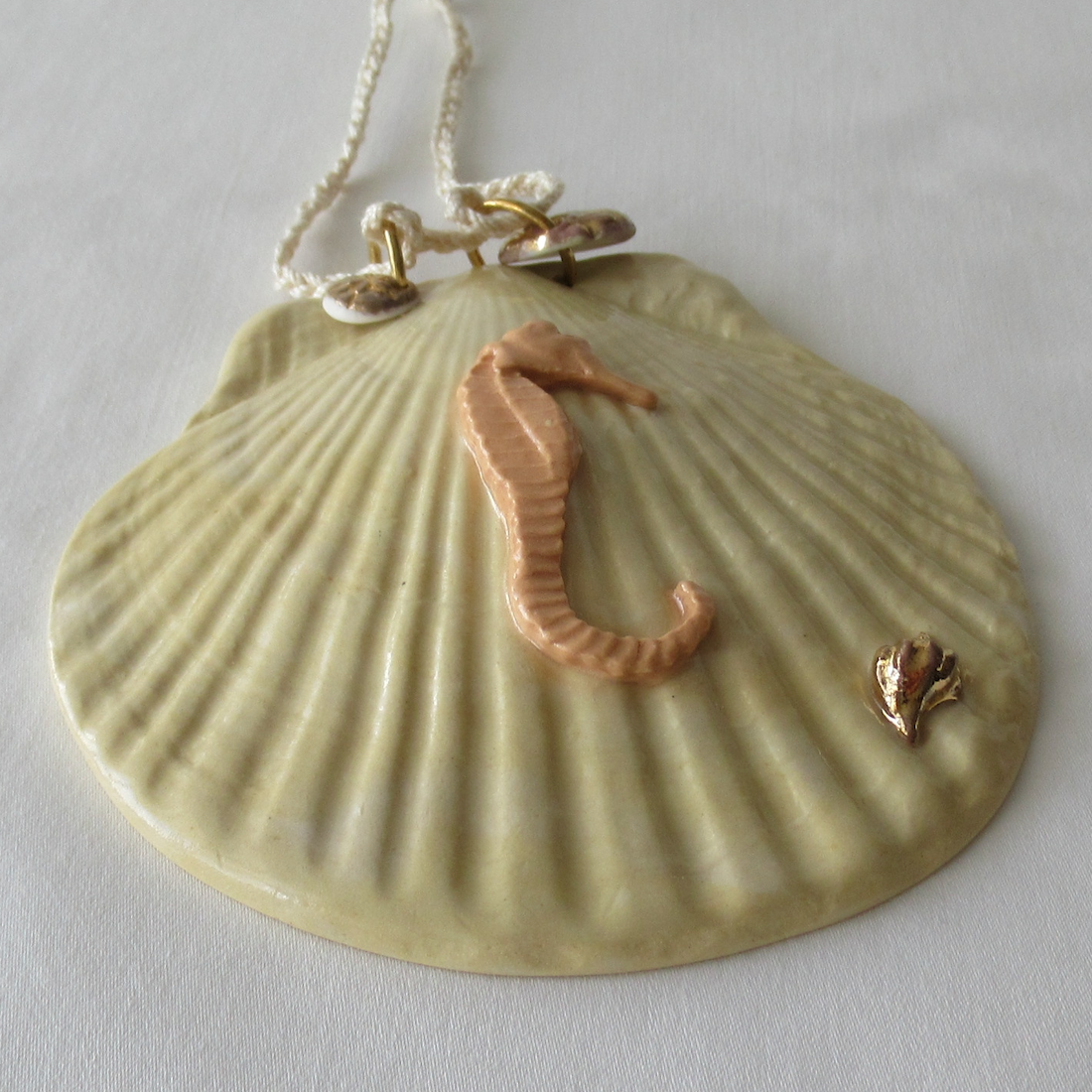 Handmade Seashell Pale Yellow Colored Porcelain Hanging Ornament. Ceramic Pottery.