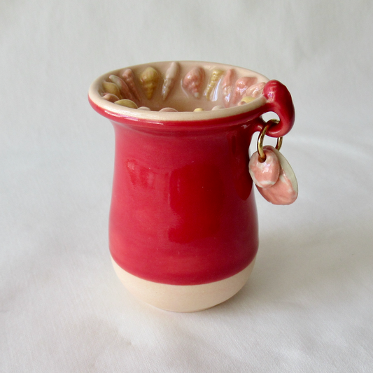 Handmade Seashell Bud Vase. Dark Red Celadon Glaze with Sand Dollar Charms.