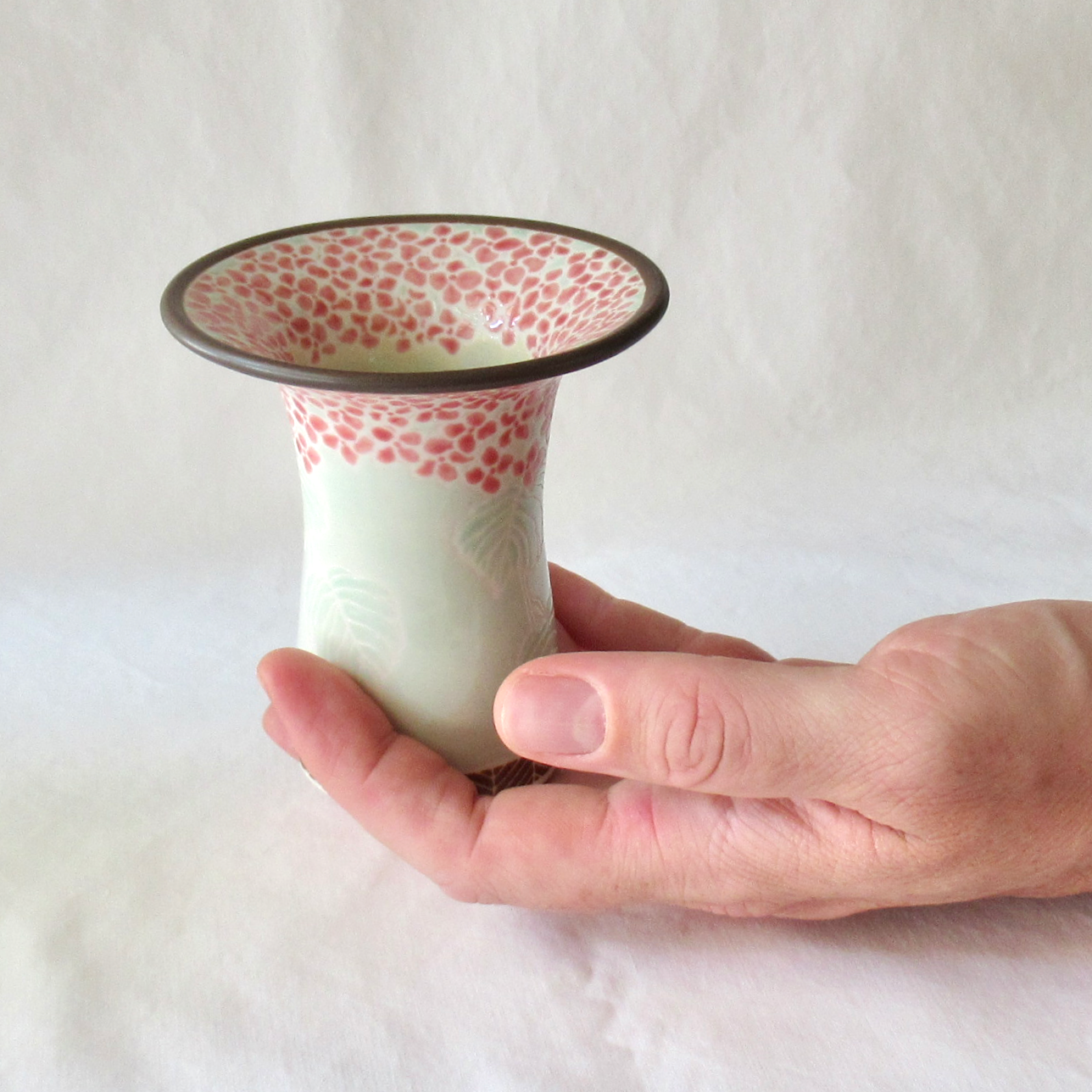 A Handcrafted Celadon Mophead Bud Vase
