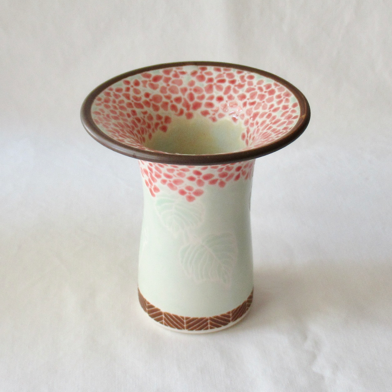 A Handcrafted Celadon Mophead Bud Vase
