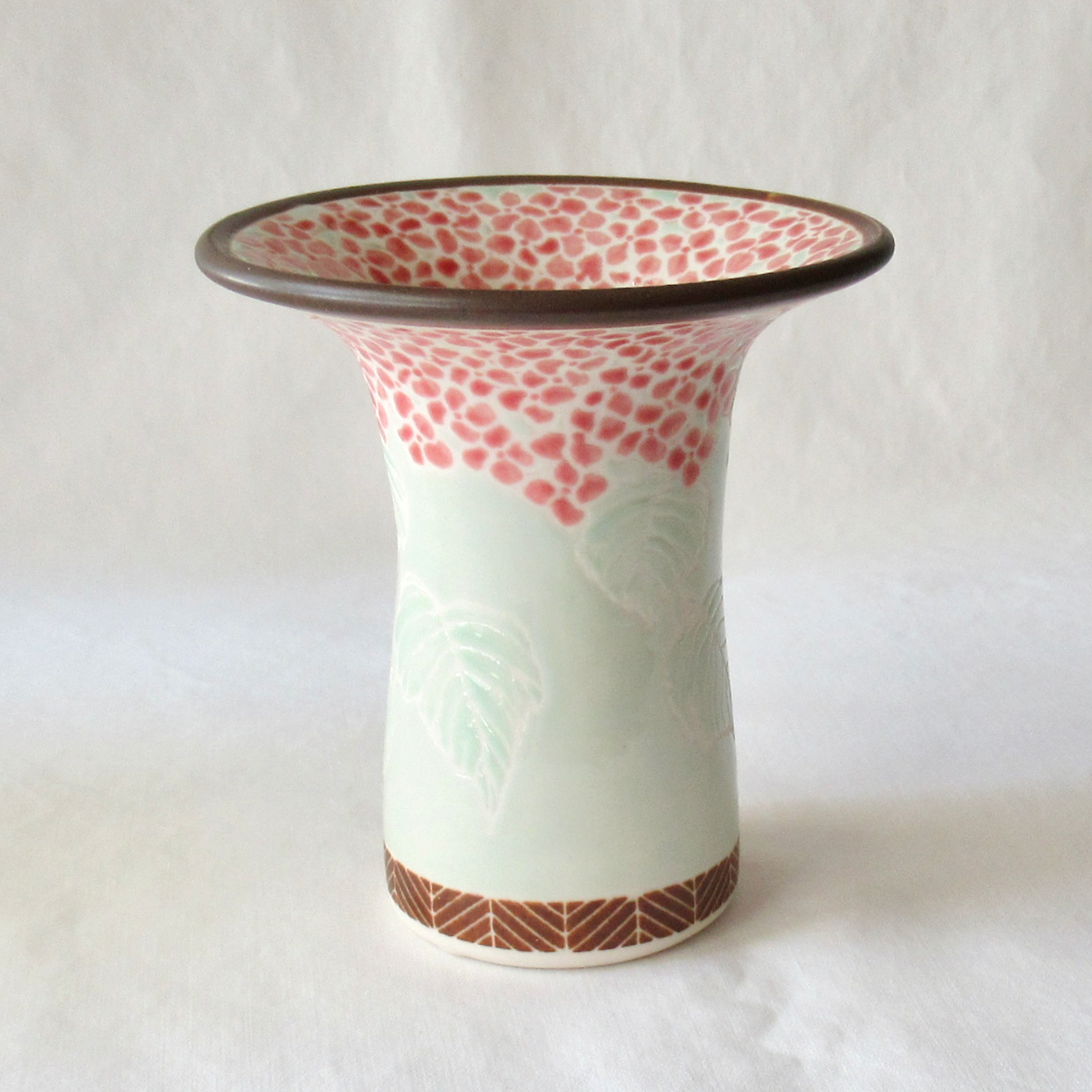 A Handcrafted Celadon Mophead Bud Vase