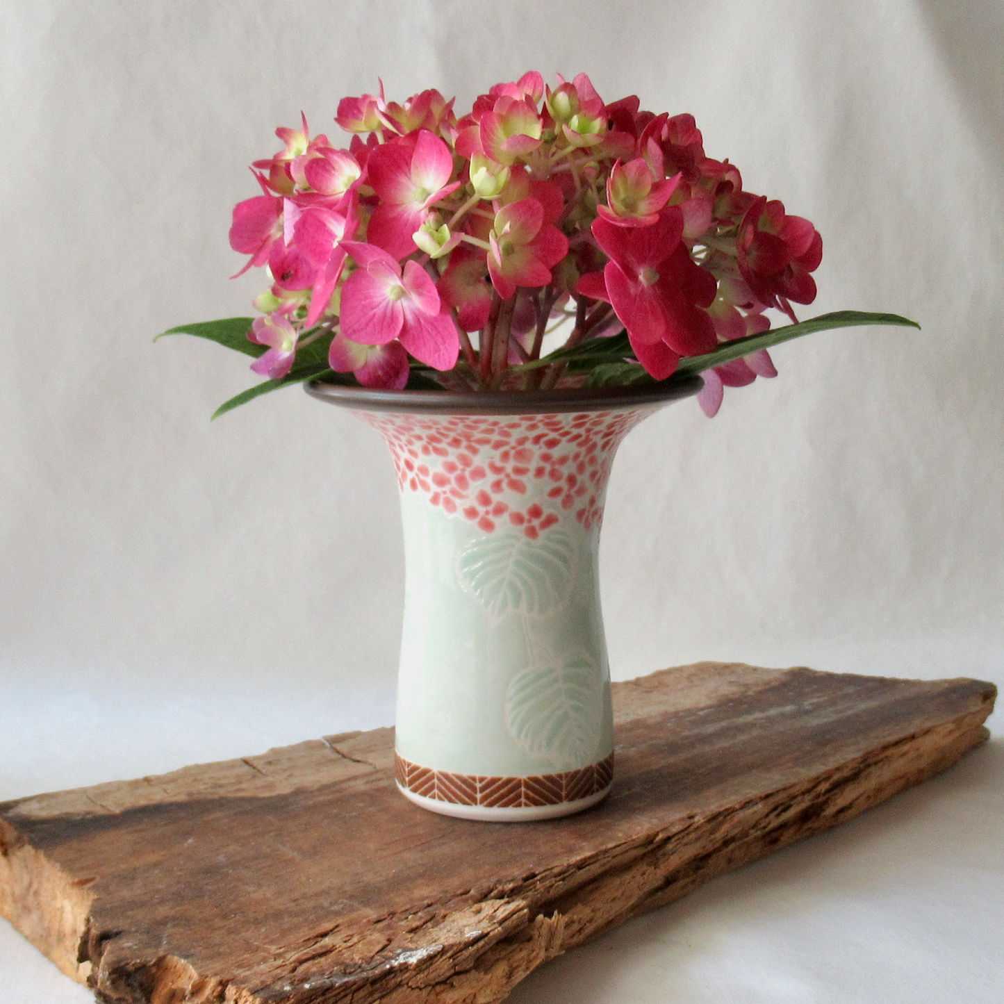 A Handcrafted Celadon Mophead Bud Vase
